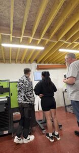 Cuchulainn Workwear technicians alongside Inkcups' Sven